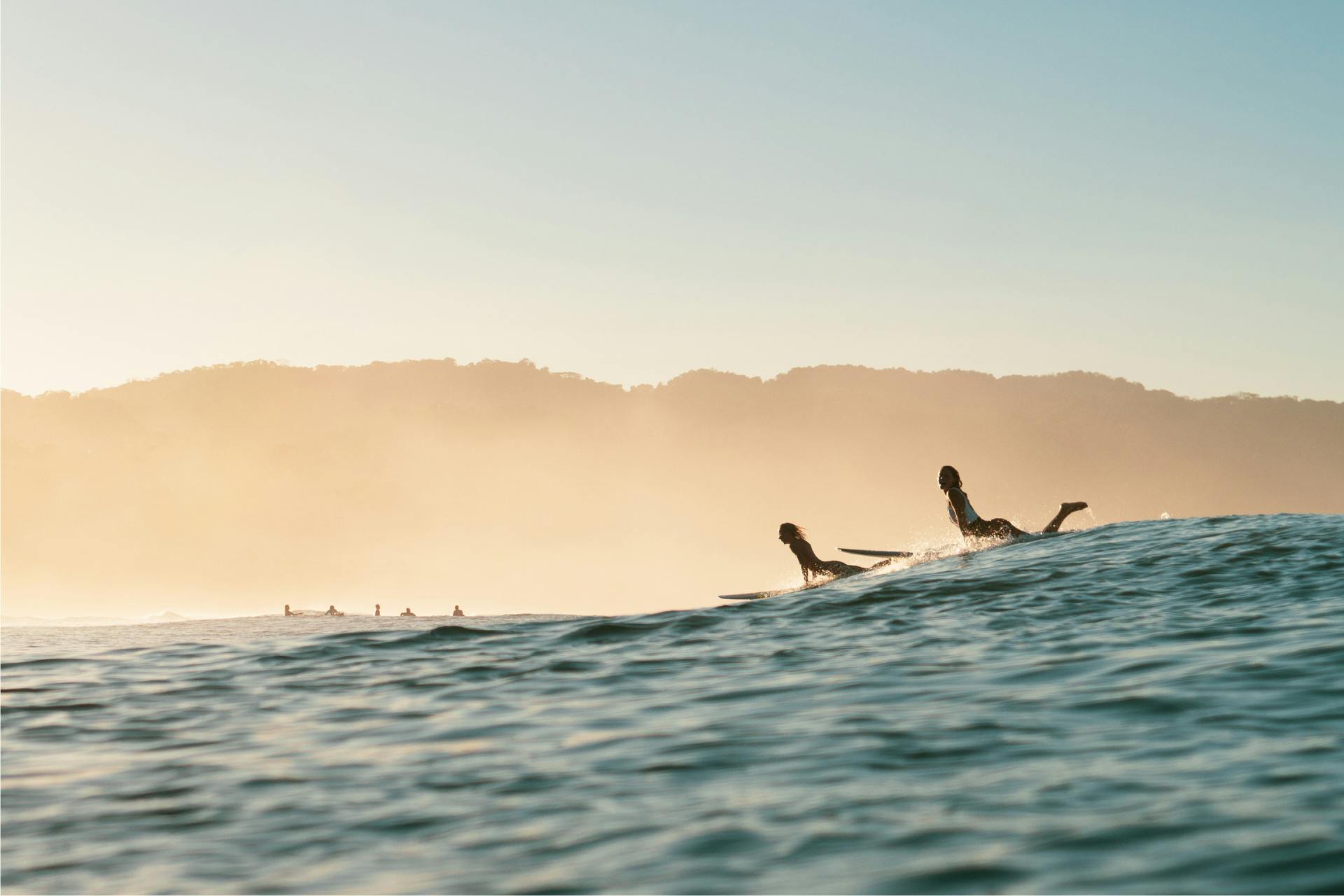 a surfer about to catch a wave