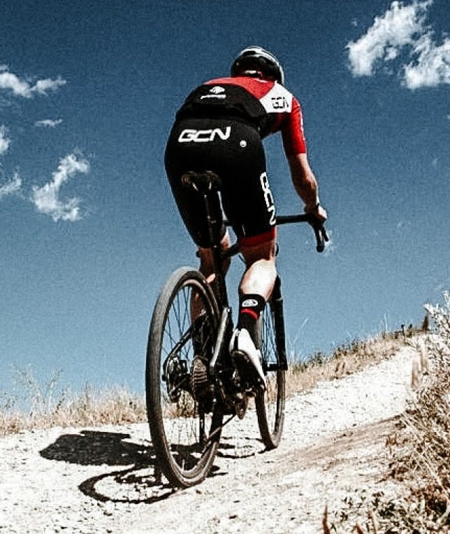 a cyclist going uphill