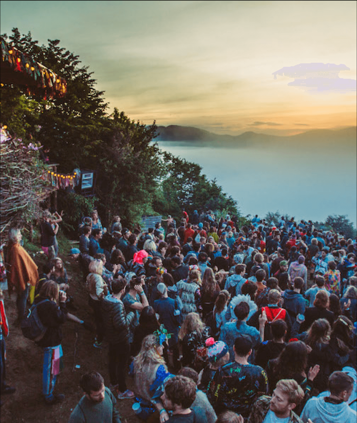 A festival crowd on a hilltop