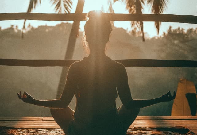 a woman practices yoga