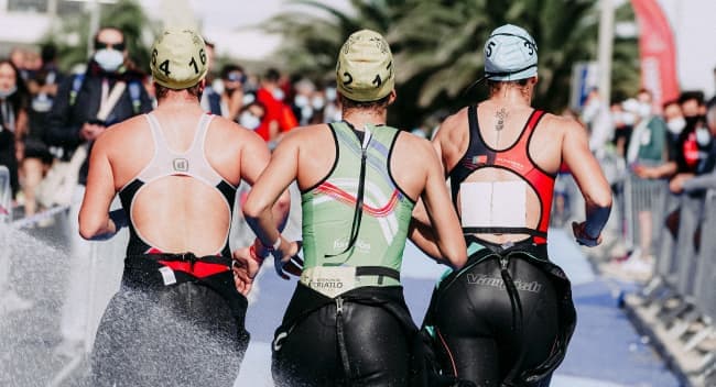 A group of women run a triathlon