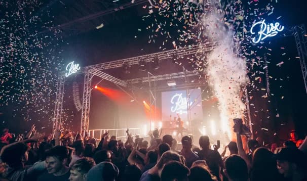 Confetti cannons blast off at a festival